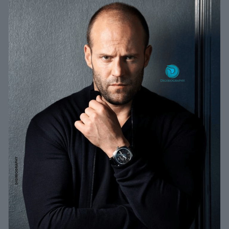 Jason Statham wearing a black full slive t-shirt and gives a look