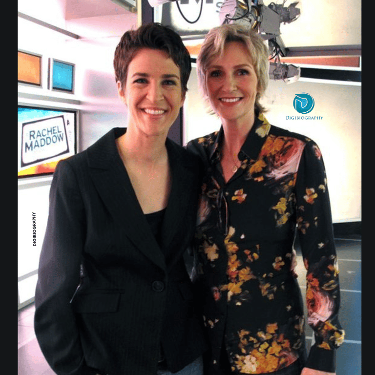 Racheal Maddow stands in the studio with her friend