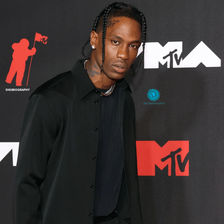 Travis Scott wearing a black shirt and attends an MTV award faction