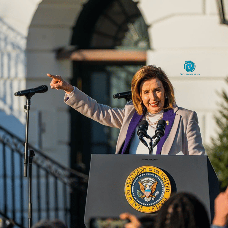 Nancy Pelosi stands on the stage and gives a speech to her audience