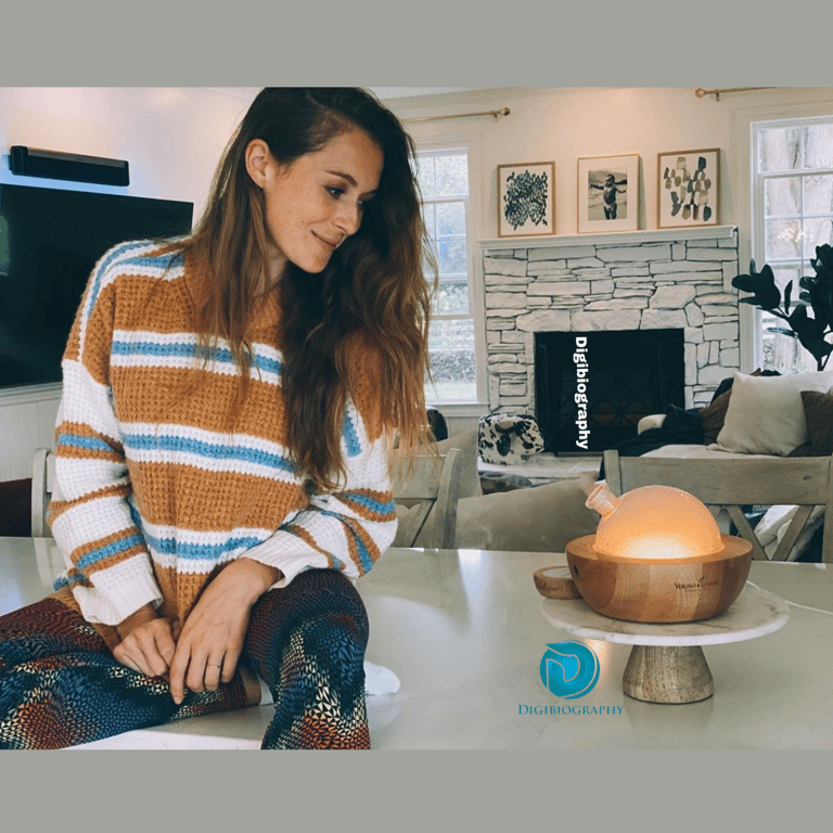 Alexa Vega sitting on the white slab and in his house