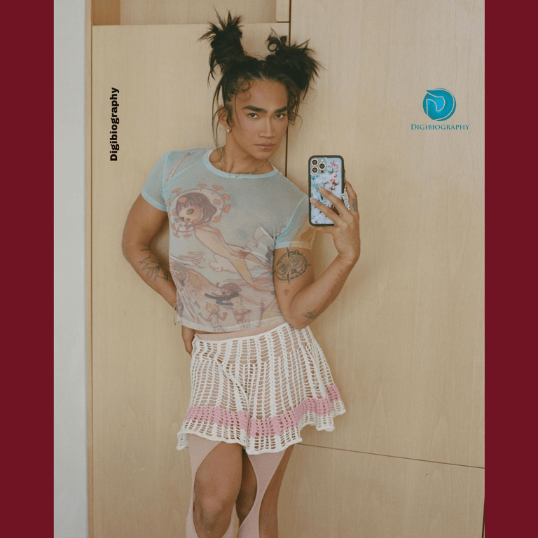 Bretman Rock taking a mirror photo in their house while wearing a frock