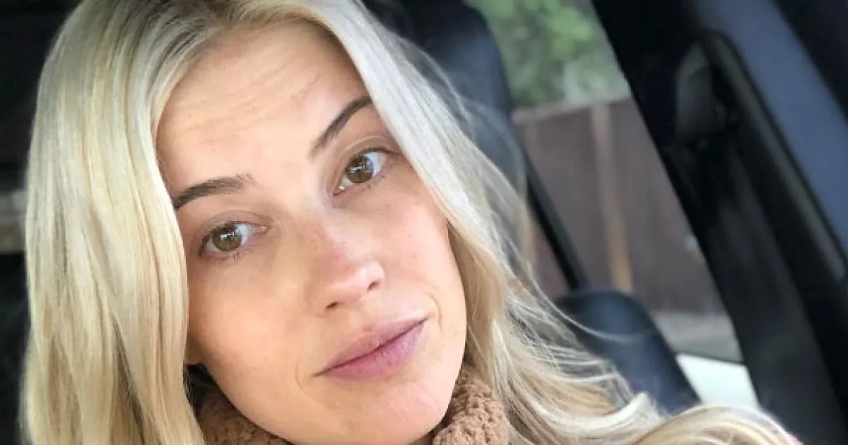 Christina Anstead showing nomakeup photo while sitting in a car