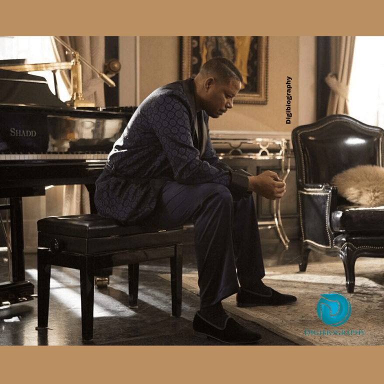 Terrence Howard sitting at the table of piano while wearing a night suit