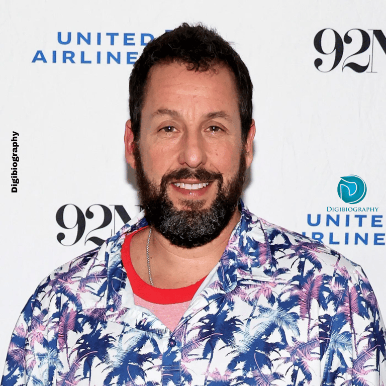 Adam Sandler attends an award show while wearing a white and blue shirt