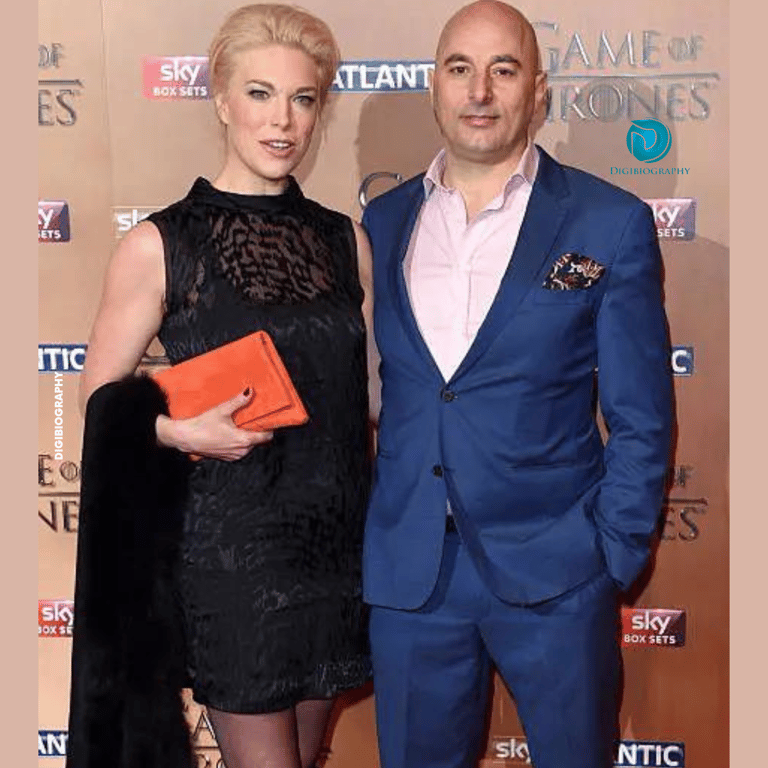 Hannah Waddingham wearing a black dress and stand with her boyfriend Gianluca Cugnetto