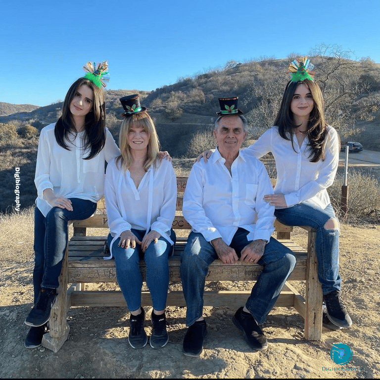 Vanessa Marano sitting on the bench with the family in the same white color combination shirt
