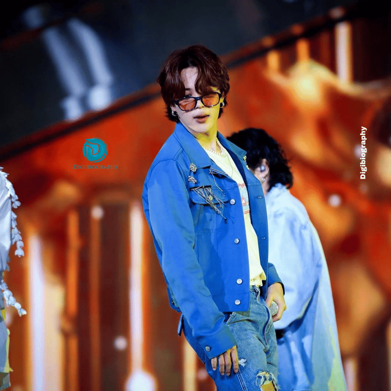 Park Jimin wearing a blue jacket in the concert 