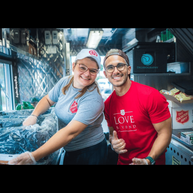 Carlos PenaVega had a photo with a co-worker while wearing a red t-shirt