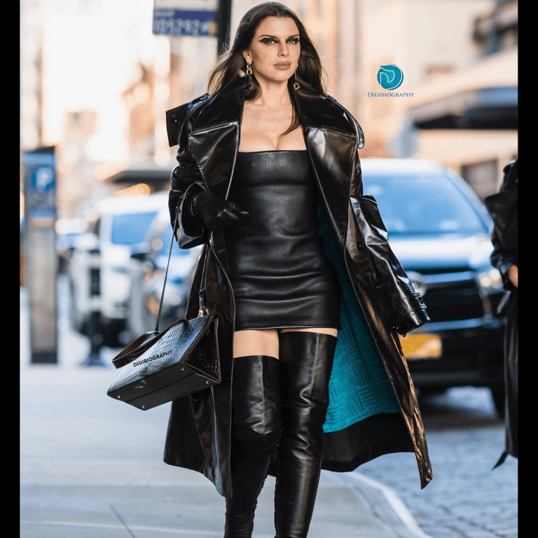 Julia Fox wearing a black blazer and walking on the road