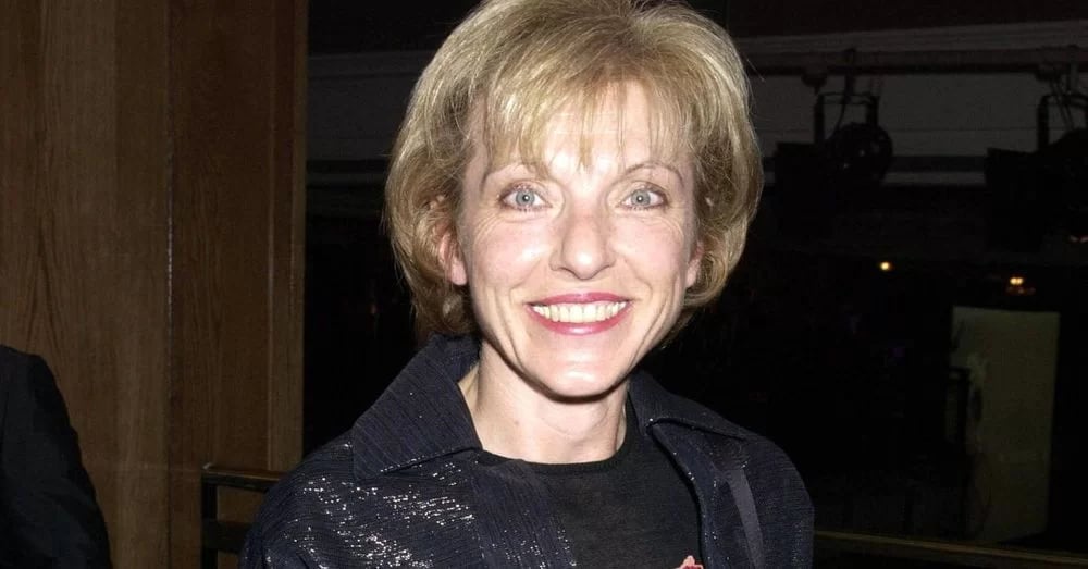 Mary Austin giving a smile and wearing a black jacket