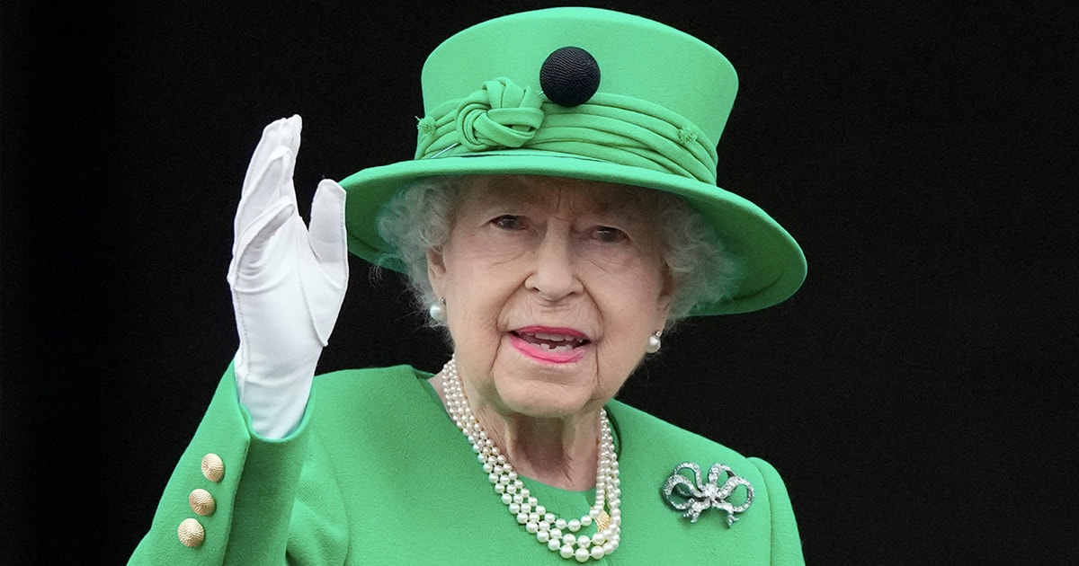 Queen Elizabeth II wearing a green dress and green cap 