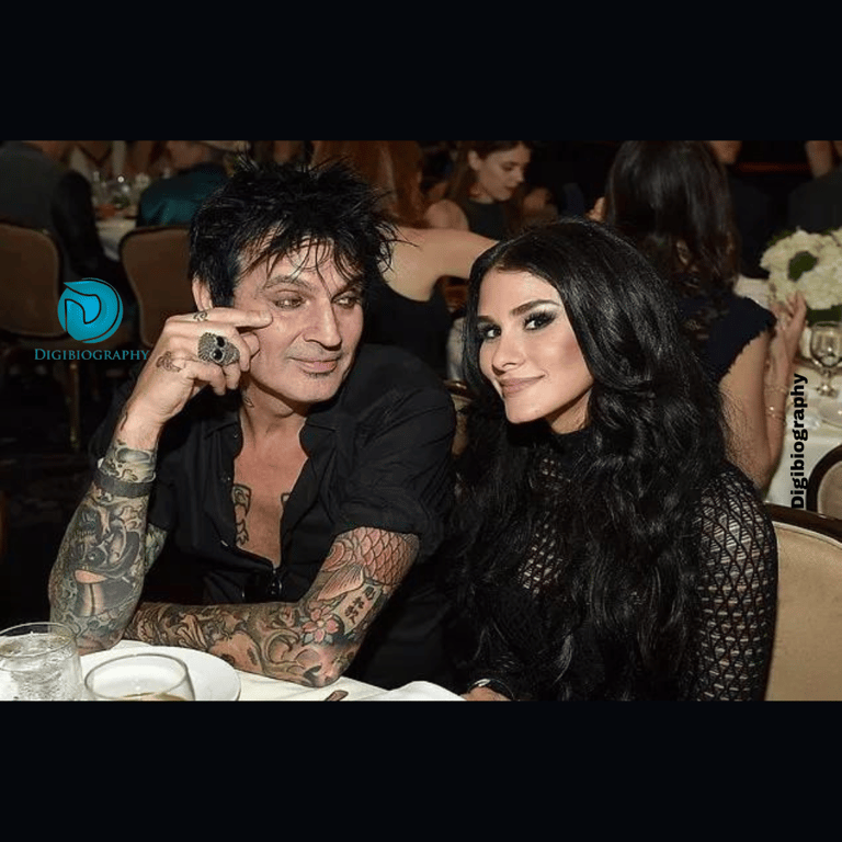 Tommy Lee sitting with the Mayte Garcia in the cafe