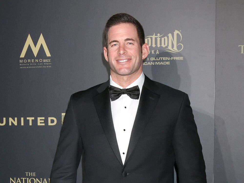 Tarek El Moussa wearing a black suit in an award show