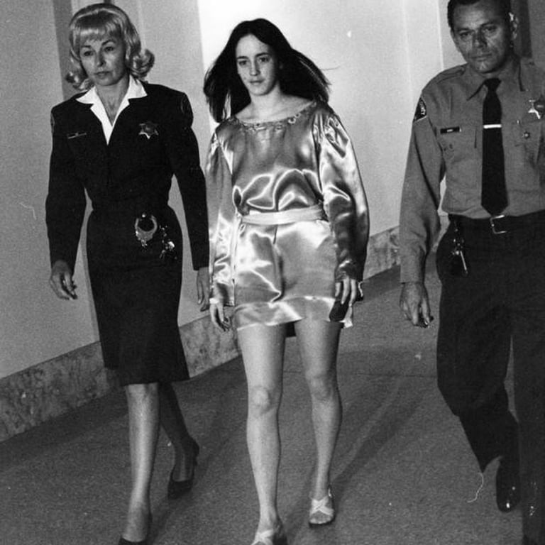 Susan Atkins walking with the Police.