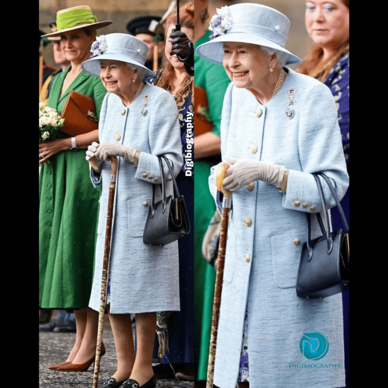 Queen Elizabeth II wearing a court and smiling
