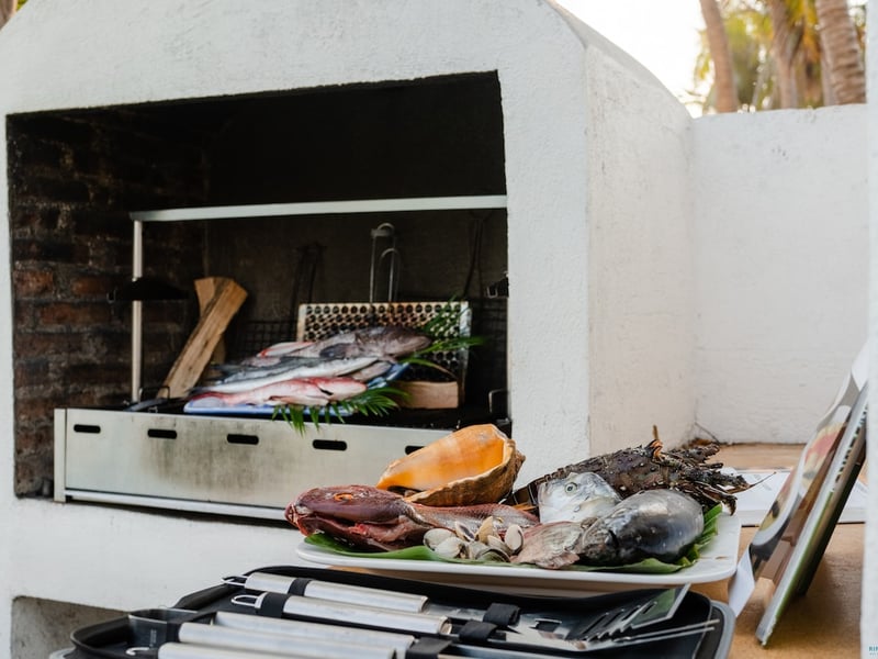 Outdoor brick grill with fresh fish and seafood, ready for the beach party grill