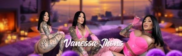 A person in colorful swimwear posing confidently on a luxurious purple bed with sunset views and fireplace in the background.
