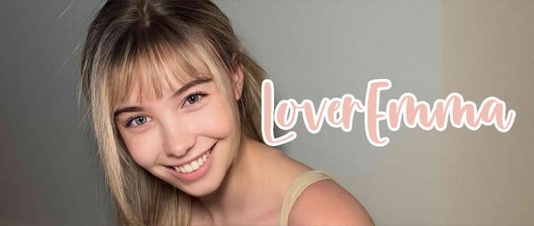 Young woman with blonde bangs smiling at the camera against a plain background, with pink text overlay of her username.