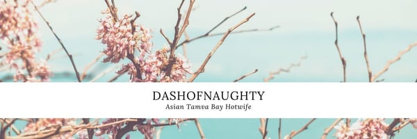 Artistic image of pink cherry blossoms against a light blue sky with the username 'dashofnaughty' and 'Tampa Bay' overlaid in white text.