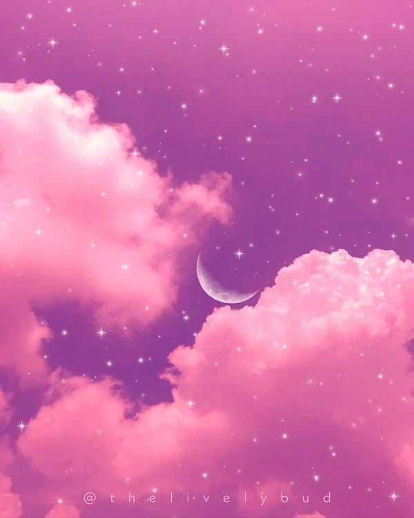 A dreamy purple sky filled with pink clouds and a glowing crescent moon.