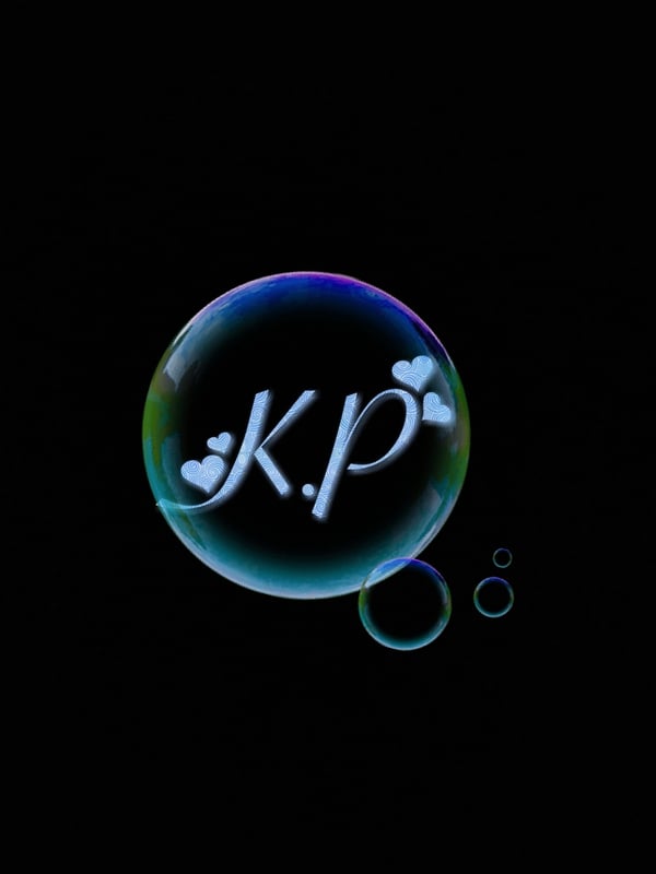 A decorative bubble featuring 'K.P.' with hearts on a black background, surrounded by smaller bubbles.