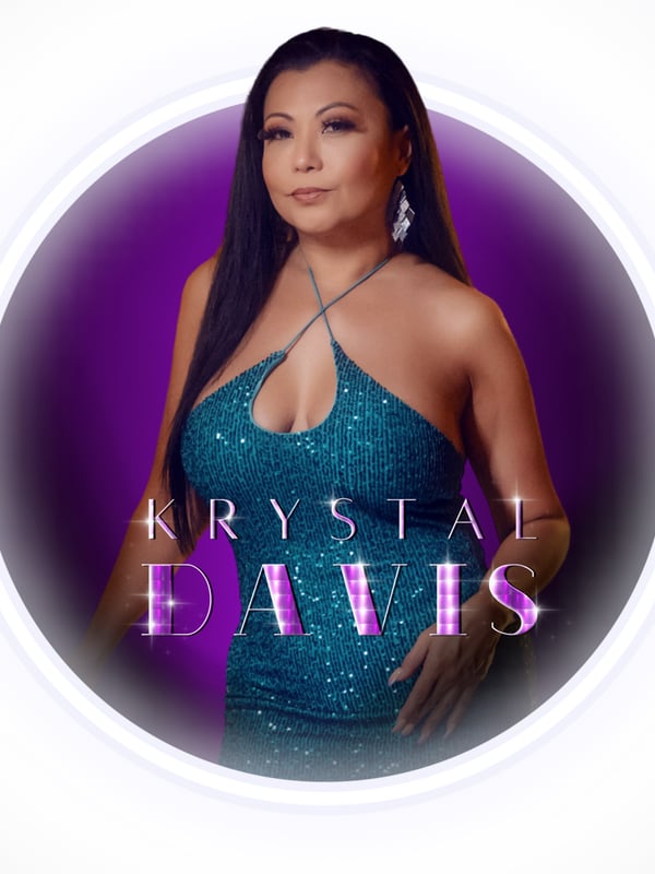 Close-up portrait of a woman in a sparkling green dress smiling confidently against a purple background with her name displayed.