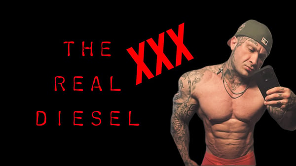 Muscular man with tattoos posing shirtless in red shorts, holding a phone, with bold text overlay on a dark background.