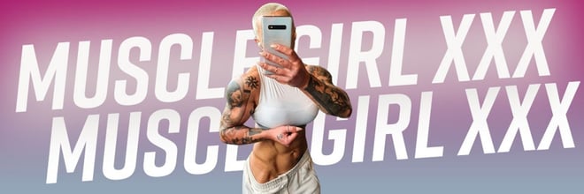 Muscular woman with tattoos flexing her abs in a white crop top, taking a selfie with bold pink text overlay reading 'Muscle Girl XXX'.