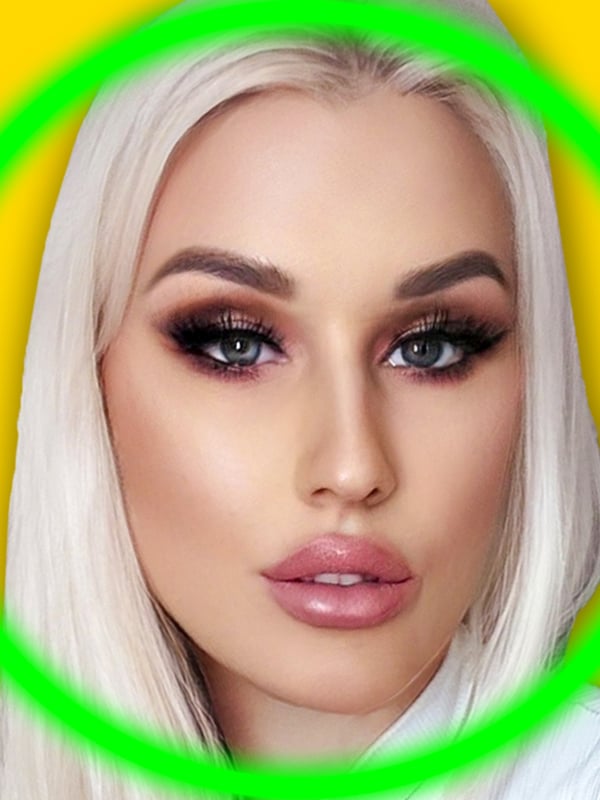 Close-up portrait of a young woman with long blonde hair, heavy makeup, and full lips, framed in a green circle on a yellow background.