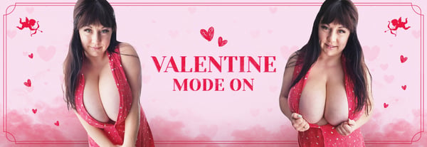 A woman with long dark hair posing playfully in a red dress against a pink Valentine-themed background with hearts.