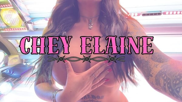 A woman with long hair and tattoos posing confidently with her arms crossed over her chest, overlaid with pink and purple text of her name against a vibrant neon-lit background.