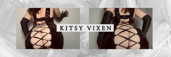 A woman posing from behind in a black lace outfit with long gloves against a white background, displaying her figure confidently.