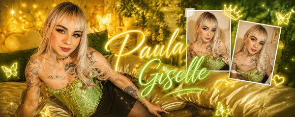 A person with blonde hair posing in a sparkly green outfit on a bed with decorative pillows and butterfly graphics.