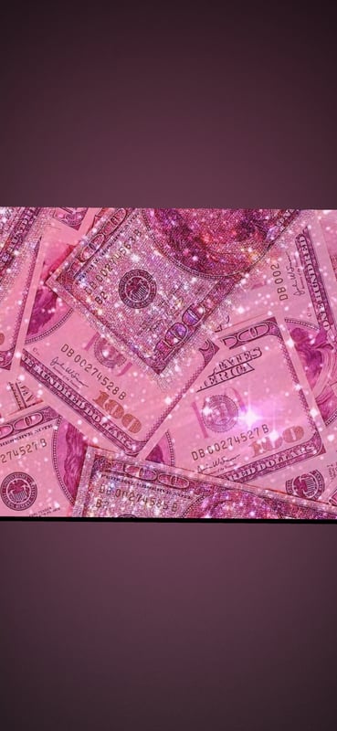 Pink-tinted image of scattered U.S. dollar bills with sparkling effects on a dark purple background.