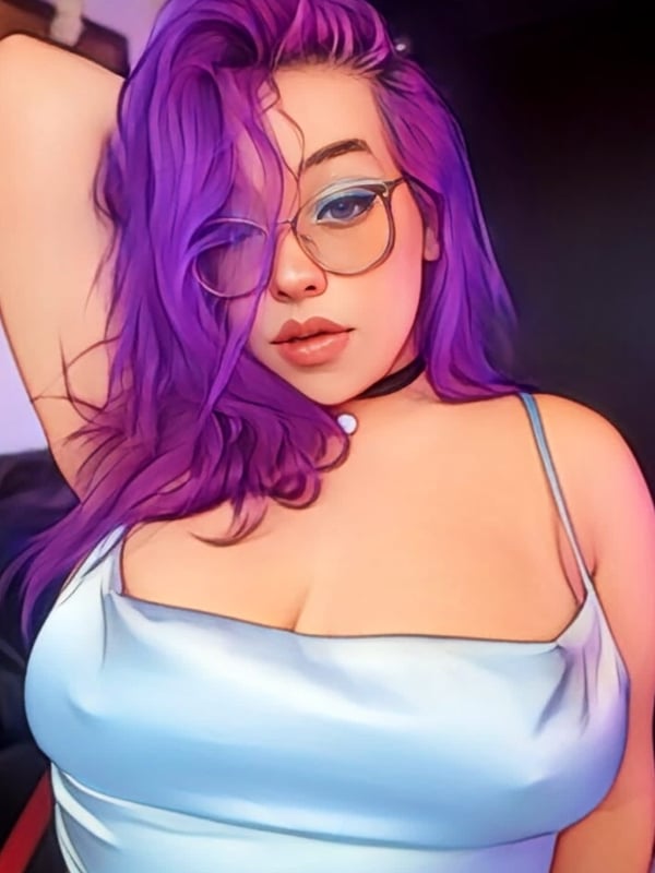A stylized portrait of a woman with purple hair and glasses, wearing a choker and silky top, posing confidently in a warm indoor environment.