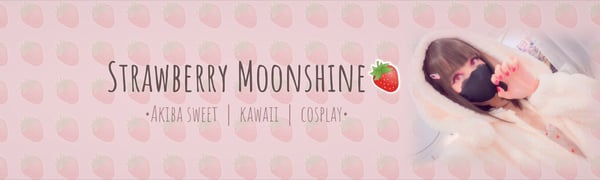 A person in a pink-themed cosplay outfit with a mask, posed against a soft background with strawberry motifs and text overlay.