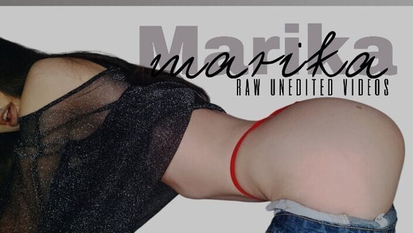 A woman posing sideways in sheer clothing and jeans, highlighting her figure with her name overlaid on a stylish background.