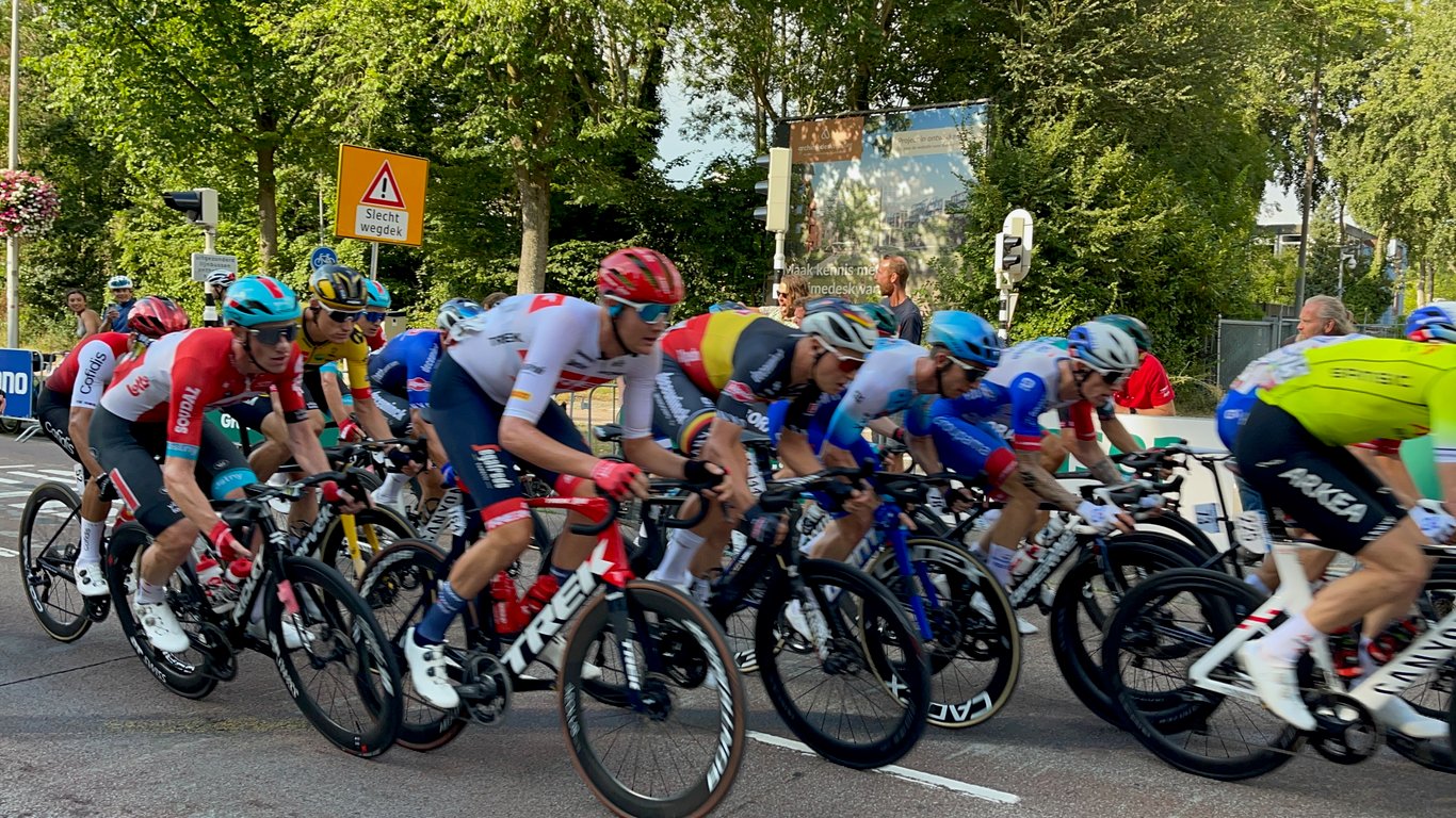 Professional Cyclists Sprint During Road Race