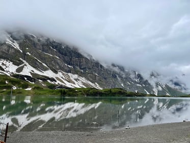 Snow-Capped Alps Reflecting in a Serene Mountain Lake