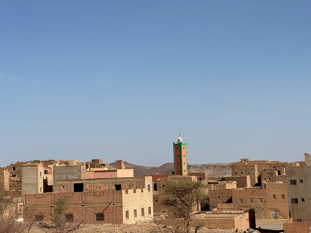 Traditional Desert Village with Colorful Minaret
