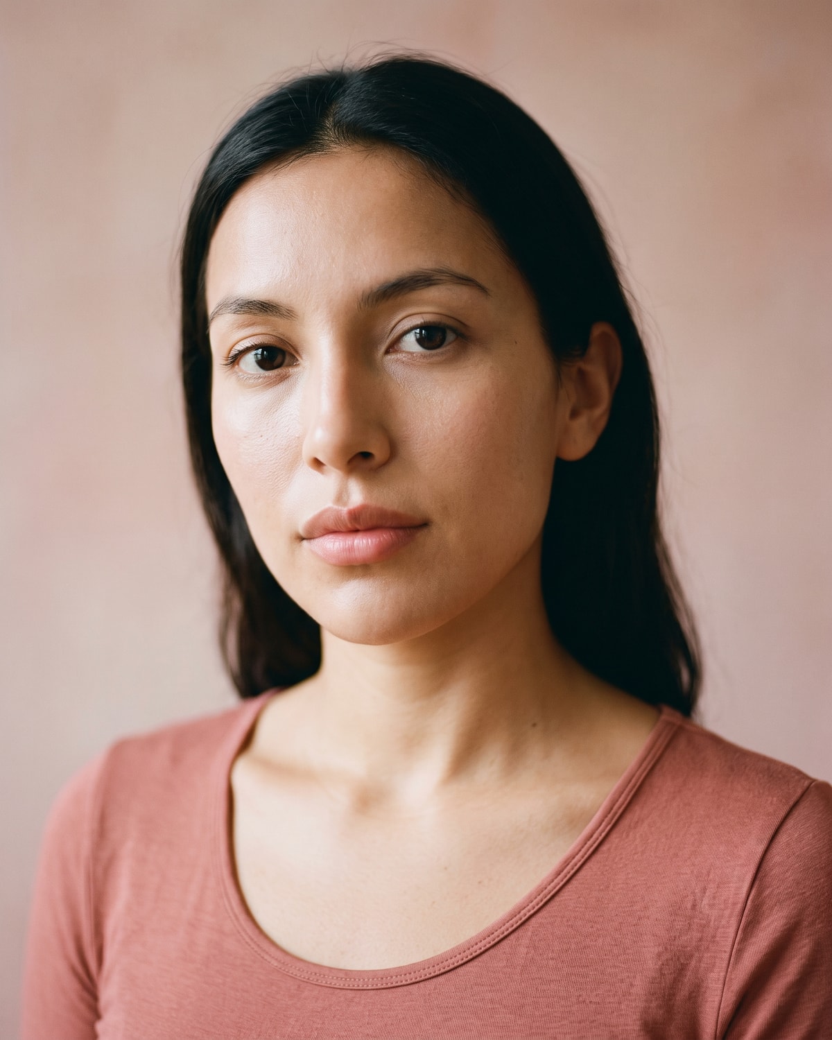 Close frontal crop of a relaxed closed mouth and philtrum in broad soft light, the cupid's bow reading clearly.