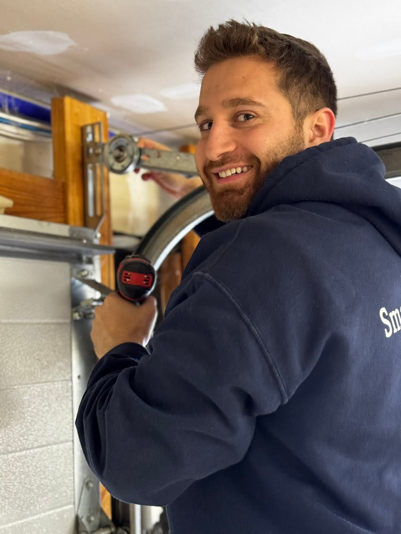 Dan, Smart Garage Doors technician, smiling on the job — the face of a real local service company