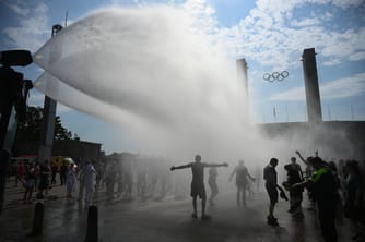 Berlin Deploys Police Water Cannons for Mist as Heat Soars