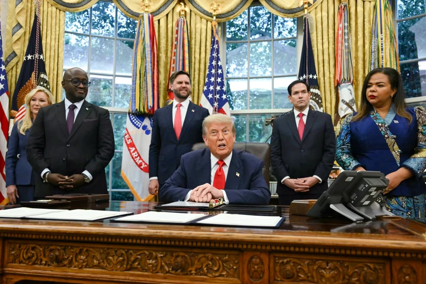 President Trump with the foreign ministers of Congo and Rwanda at the signing of the two countries’ peace agreement in June. Photo: andrew caballero-reynolds/AFP/Getty Images