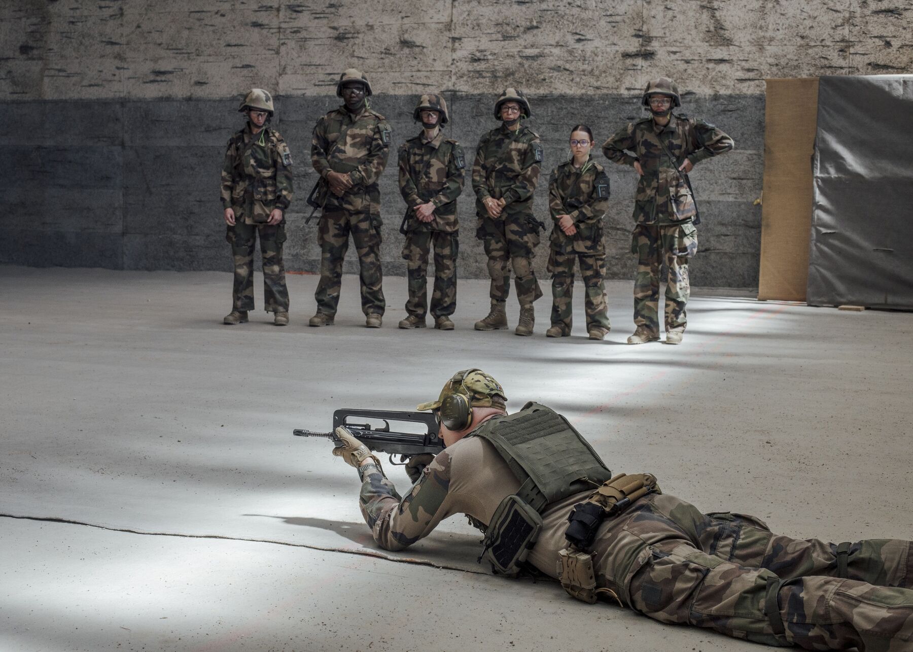 Matthieu, a second lieutenant in the French Armed Forces' 19th Engineer Regiment, during a firing drill with recruits at a reservist training camp in Besançon, on April 30. 