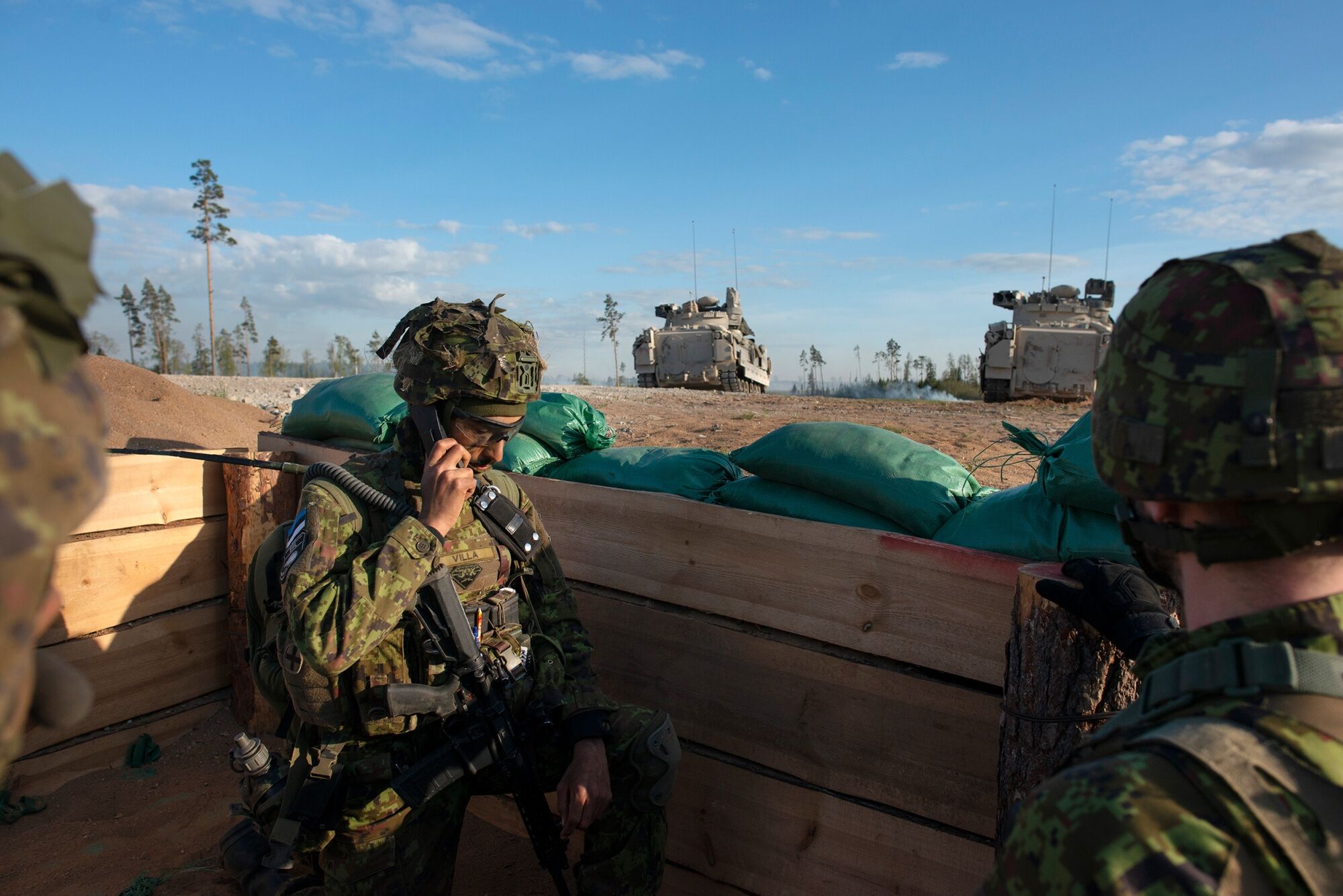 Estonian Defense Forces soldiers and US Bradley fighting vehicles during Exercise Hedgehog 25 in Estonia on May 20. Photographer: Peter Kollanyi/Bloomberg