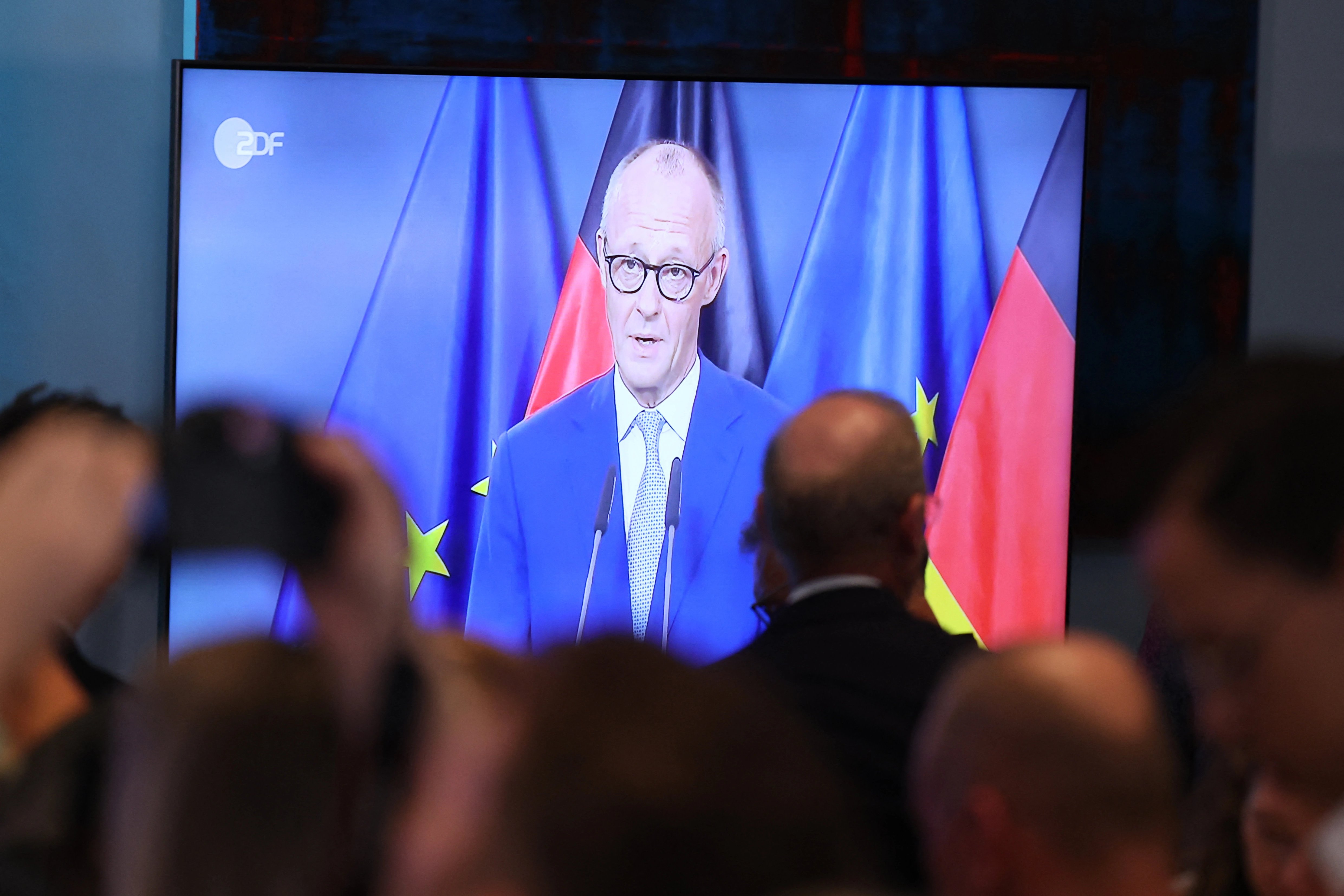 CDU members watching German Chancellor Friedrich Merz delivering a statement in Berlin, Sept. 20, 2026 - AFP