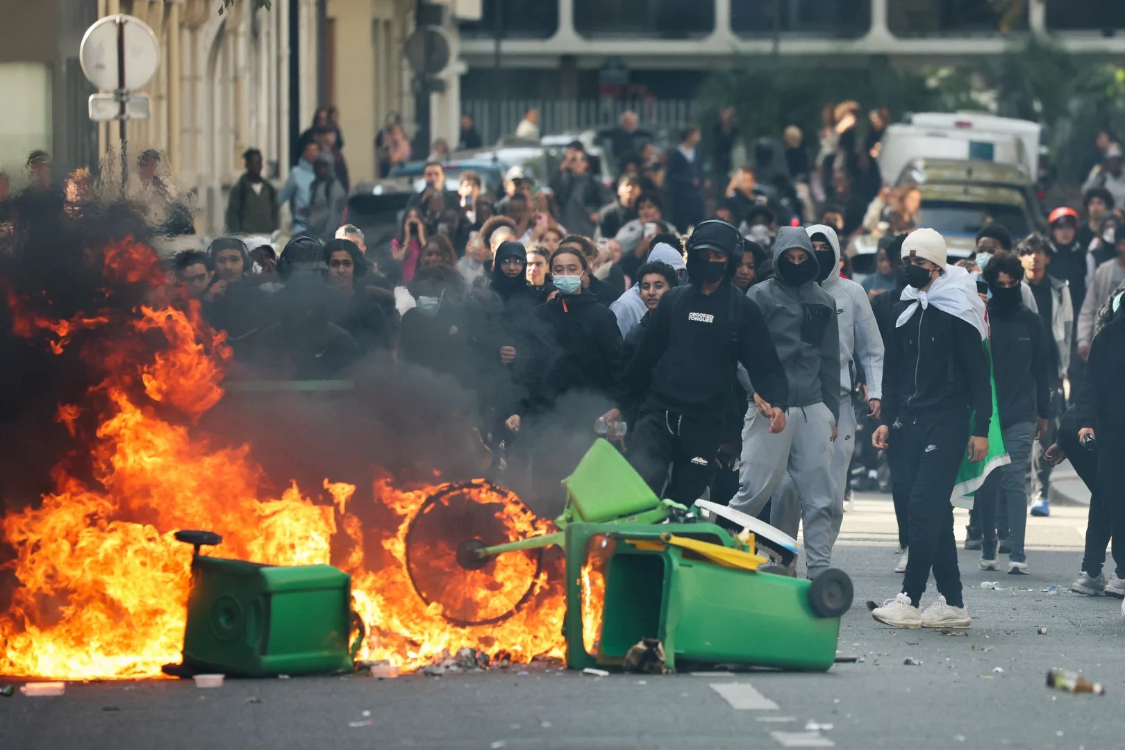 A trash bin on fire as protesting students blockade a road in Paris, Oct. 2, 2026 - AFP