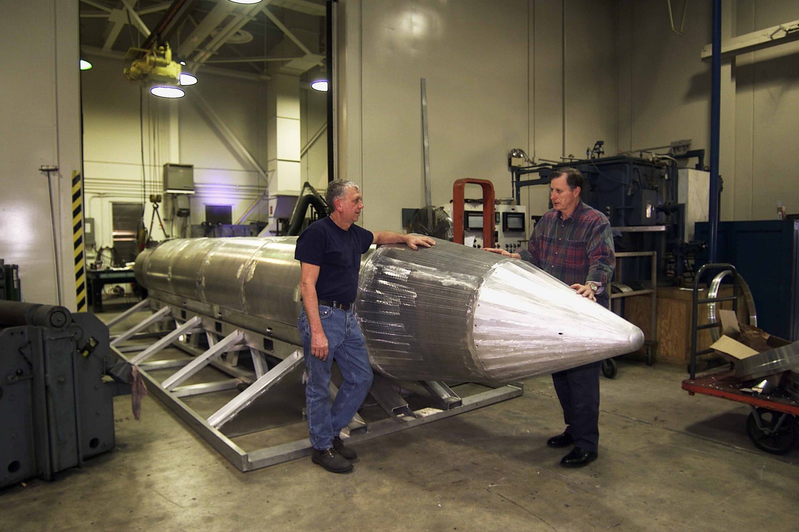 Al Weimorts (right) and Joseph Fellenz with the unpainted MOAB prototype, undated - U.S. Air Force photo (public domain)
